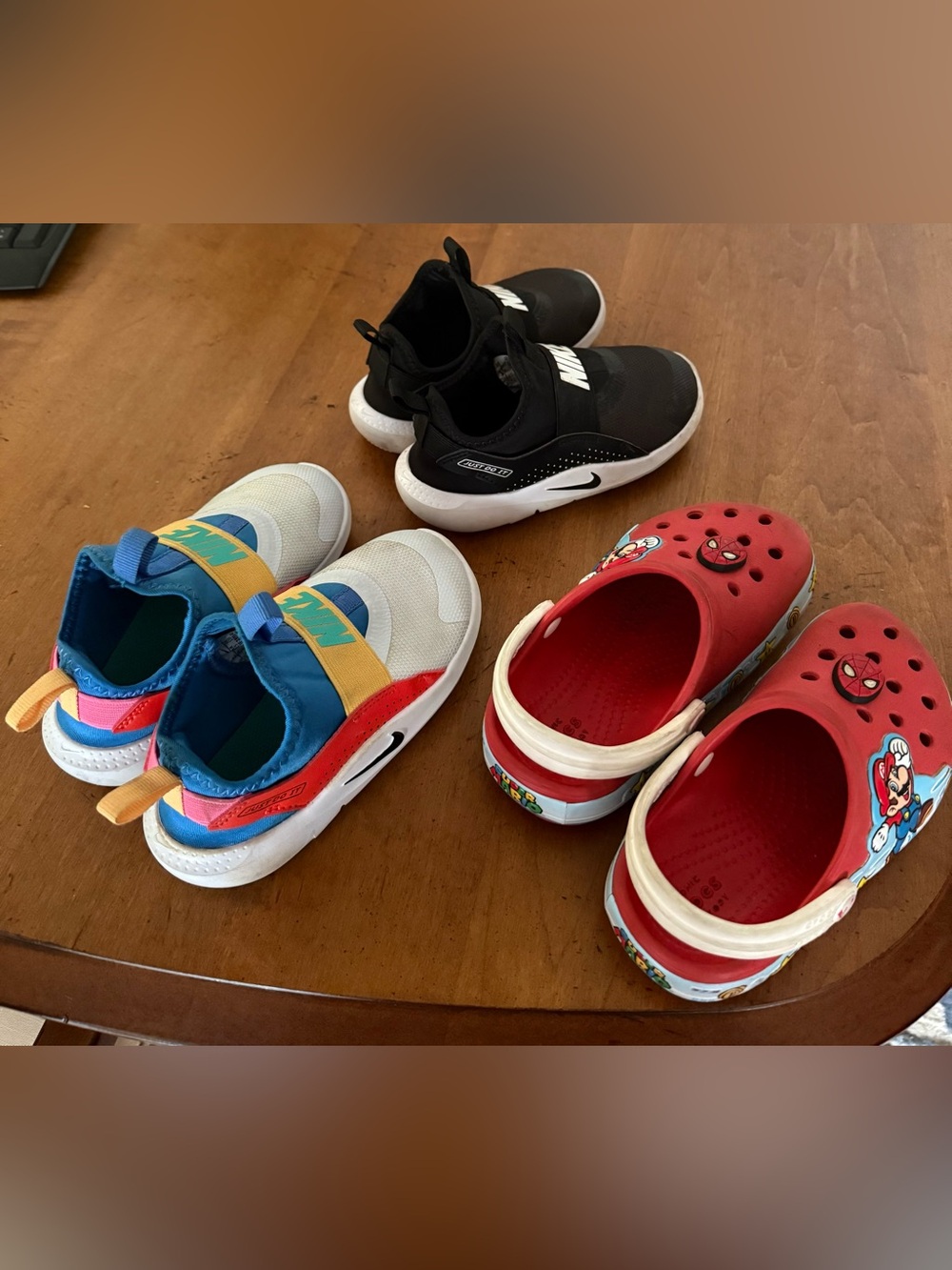 Nike Kids Slip-On Sneakers in Black and White / Multi-Color Accents